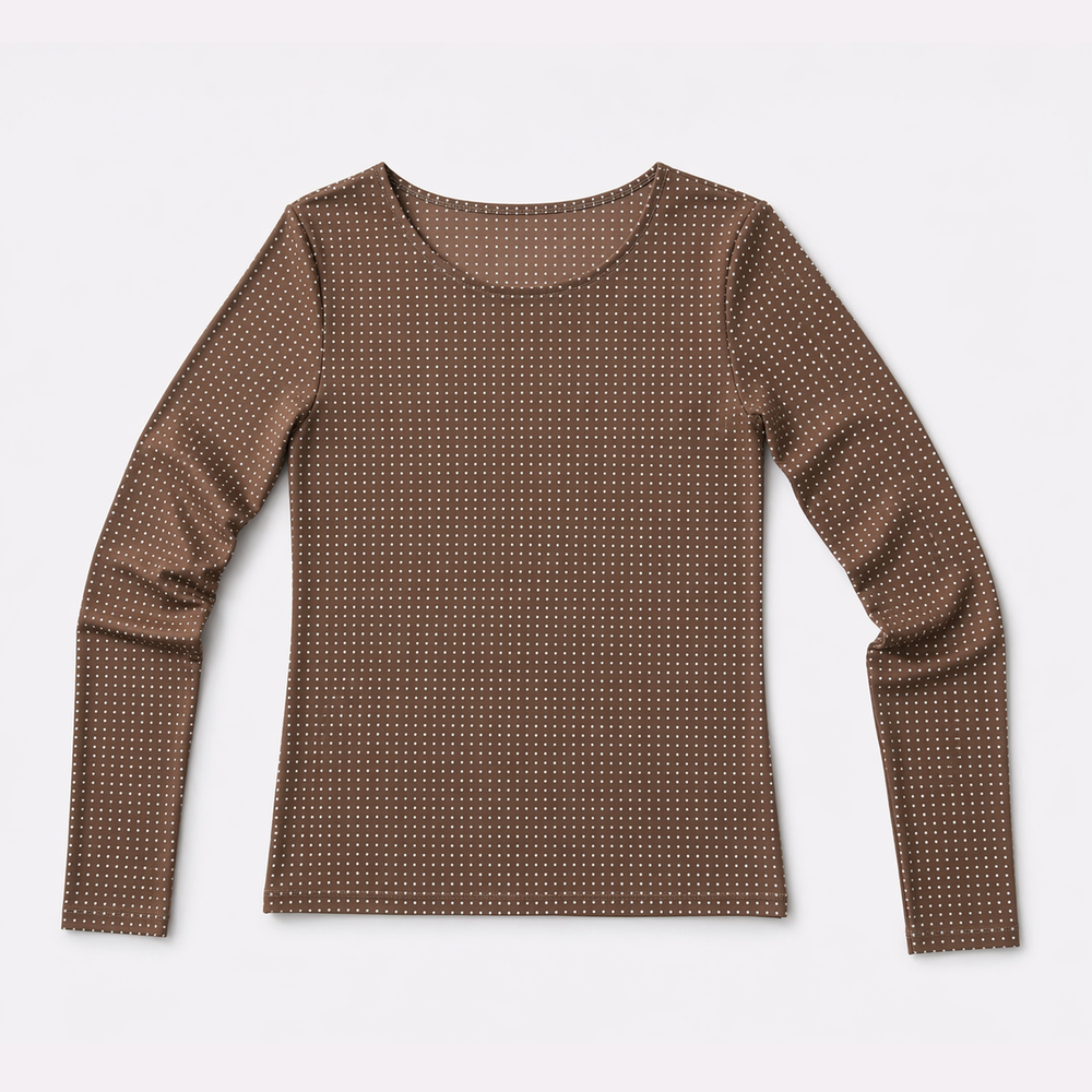 Elevated, effortless, and just a little playful. The Feeling Fancy Sheer Top features a rich Cocoa tone finished with dainty micro-dot detailing—subtle, refined, and designed to catch the light just enough.