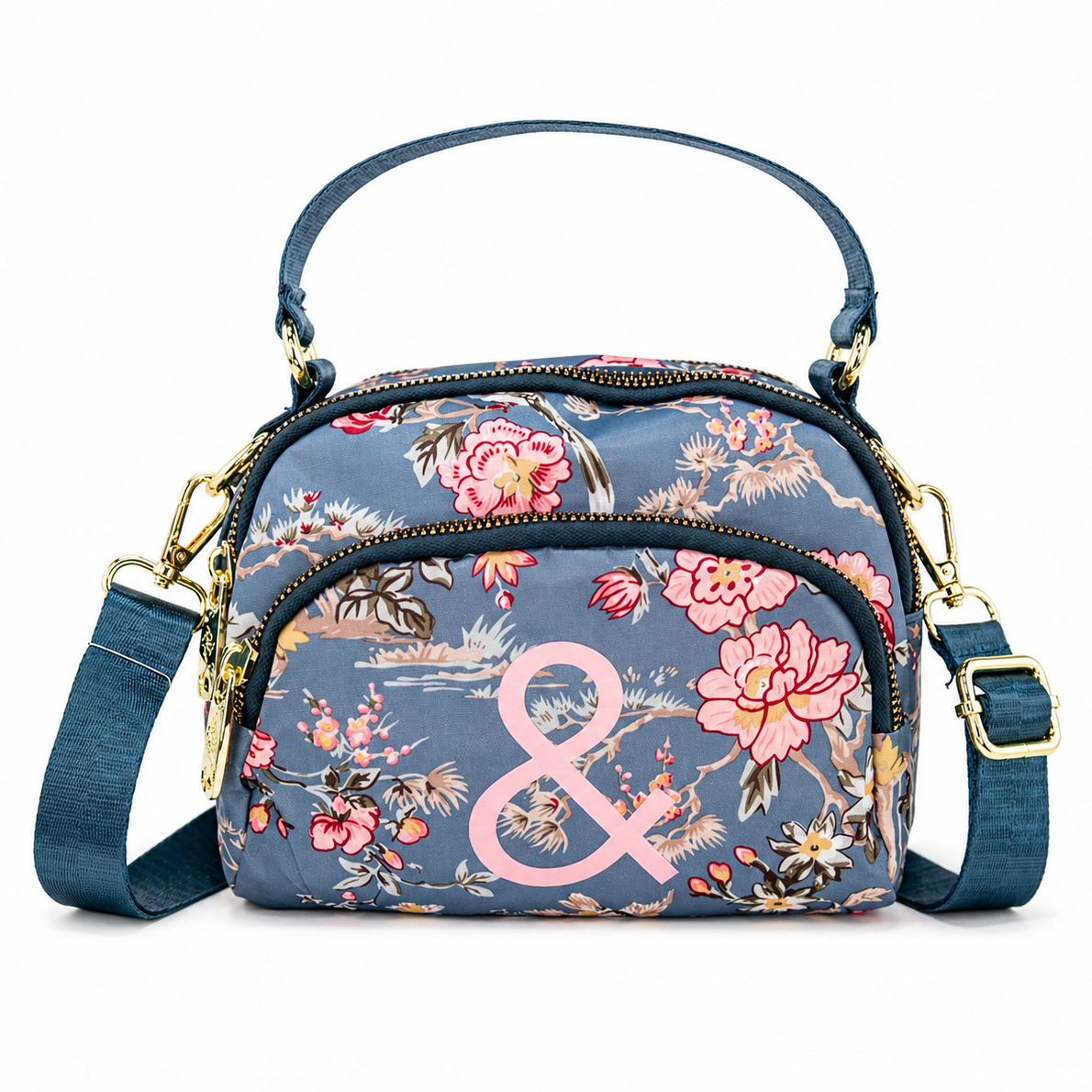 Floral patterned handbag with a pink ampersand on a white background