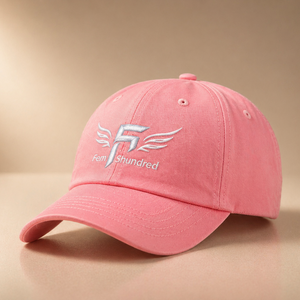 Pink cap with a logo on a beige background