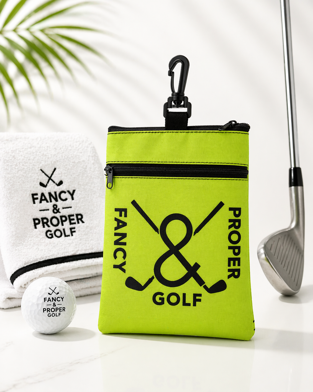 Four colorful pouches with 'Fancy & Proper Golf' branding on a white background