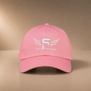 Pink cap with a logo on a beige background