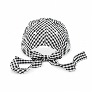 Black and white checkered headscarf with a bow on a white background