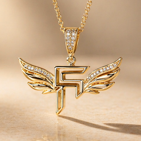 Gold necklace with a unique pendant on a beige background