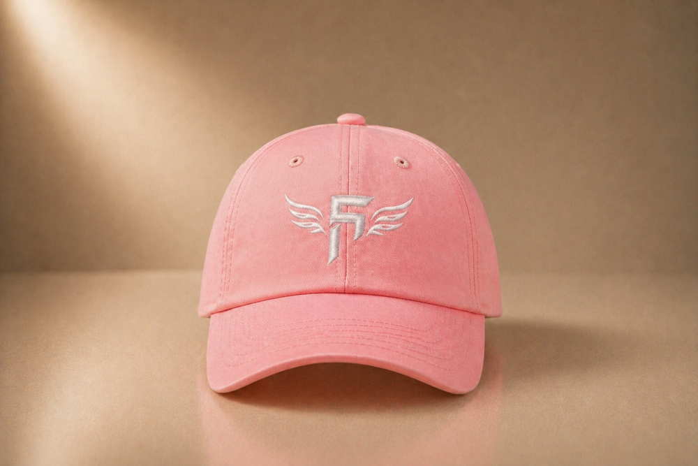 Pink cap with Fem5hundred logo on a beige background
