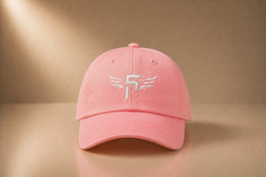 Pink cap with FEM5HUNDRED LOGO on a beige background