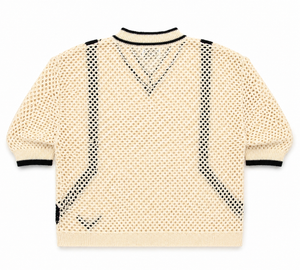 Beige sweater with black mesh panels on a white background