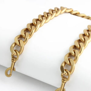 Gold chain bracelet on a white background