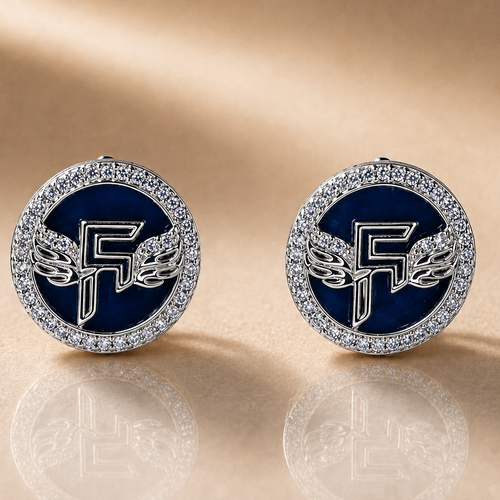 Pair of round earrings with blue center and silver 'F' design on a beige background