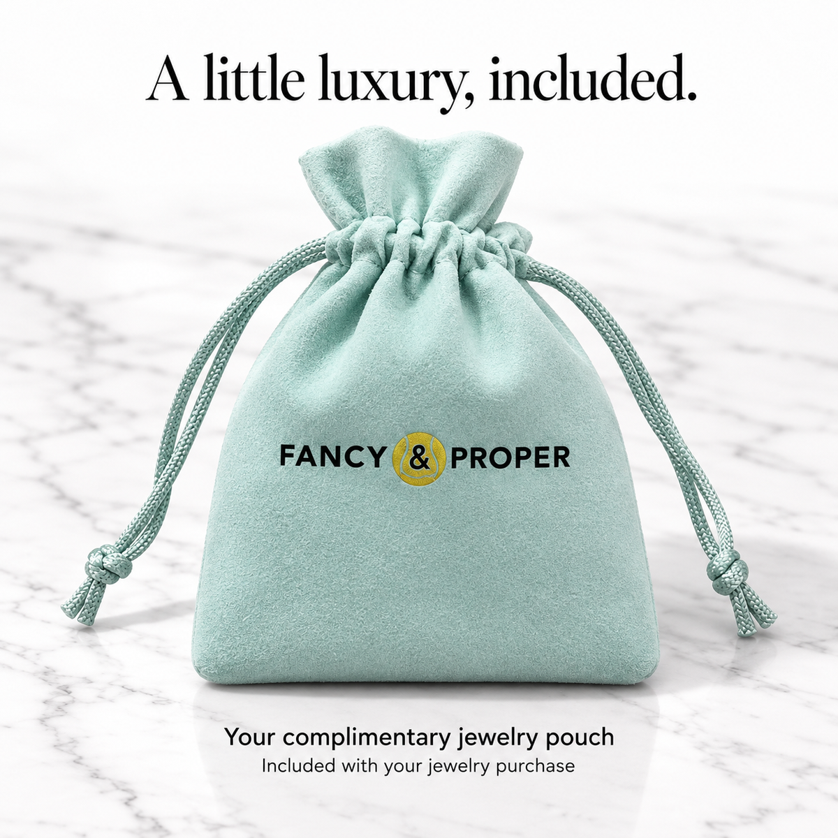 Complimentary pale aqua Fancy & Proper Tennis jewelry pouch, standing upright and full, included with this jewelry purchase.