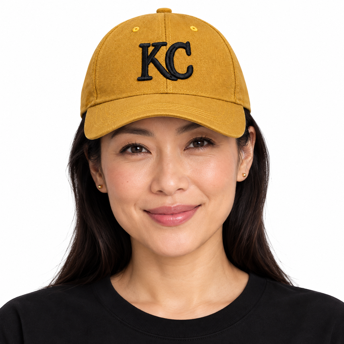 KC Monogram Cap — Mustard Gold worn by a woman, front view