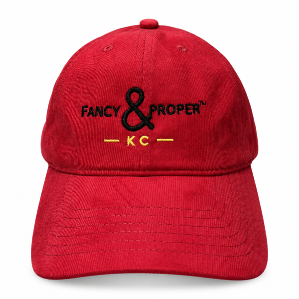 Red Fancy&Proper KC cap with soft fine-ribbed fabric, black signature embroidery and gold KC detail, front view on white