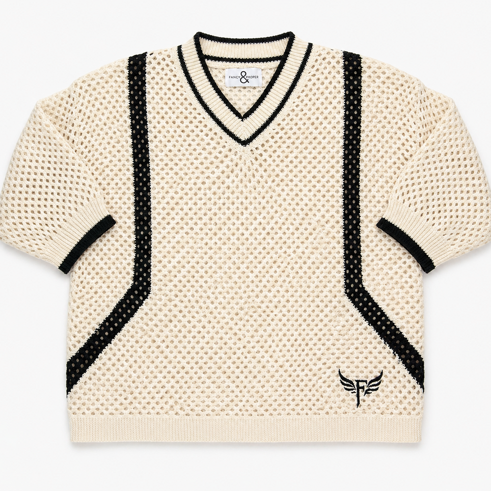 Beige sweater with black accents on a white background