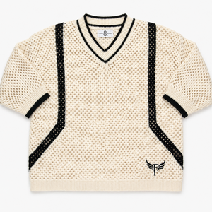 Beige sweater with black accents on a white background