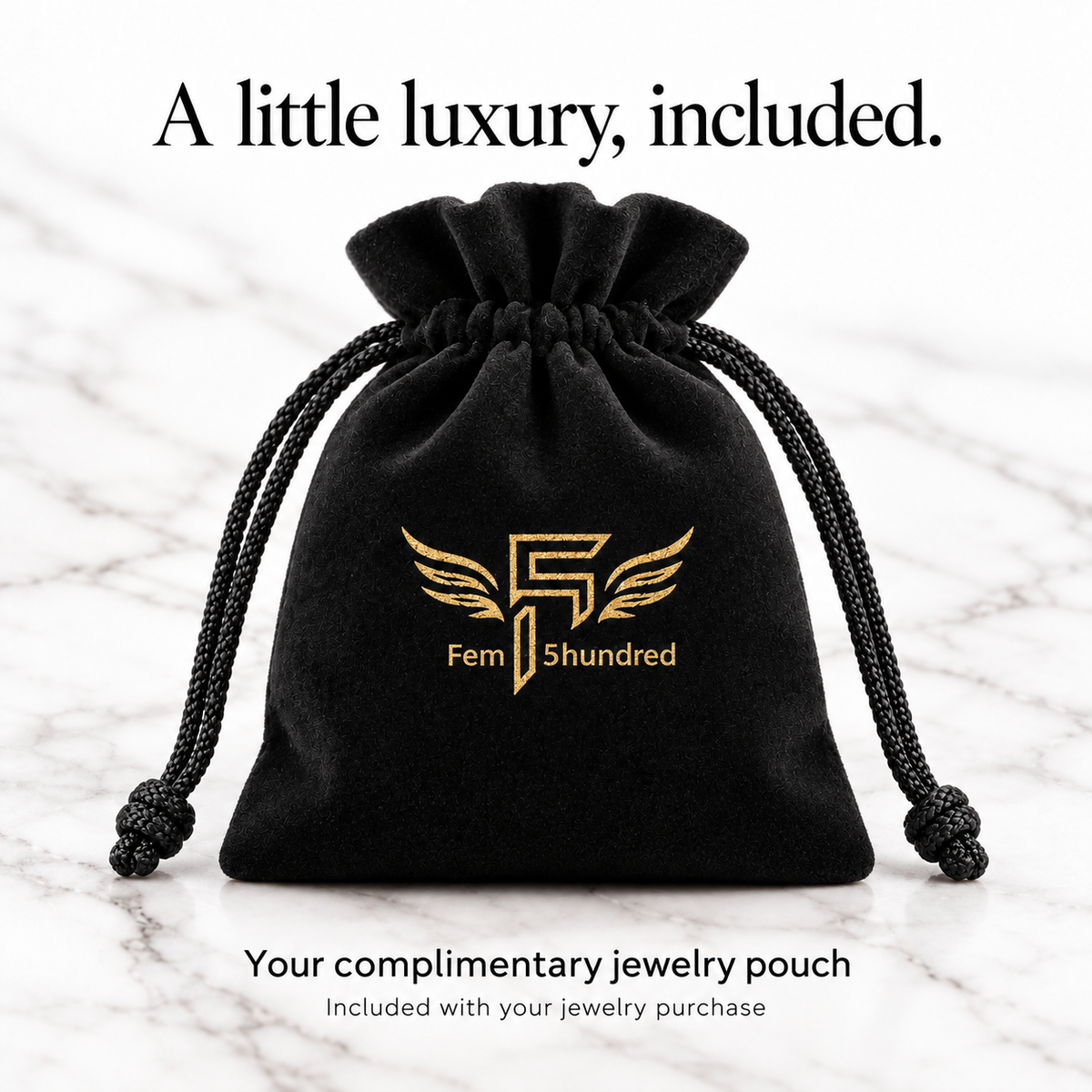 Upright full black velvet Fem5hundred jewelry pouch with gold winged logo, complimentary with jewelry purchase.