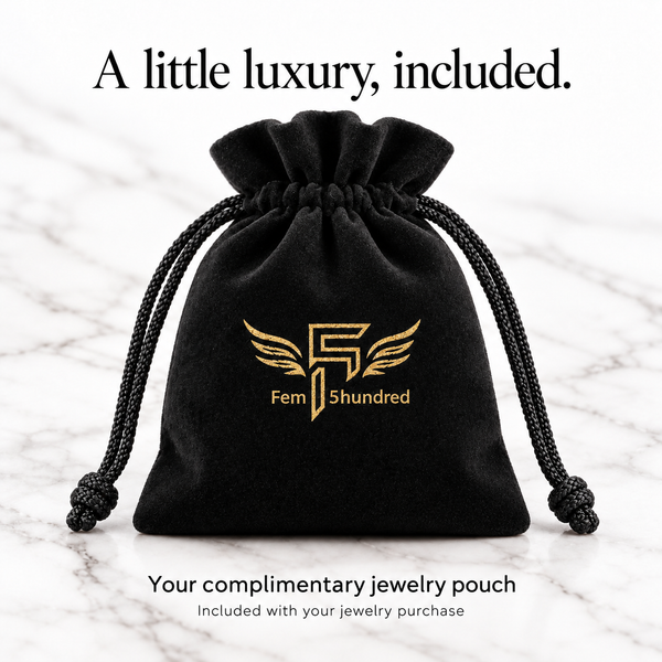 Upright full black velvet Fem5hundred jewelry pouch with gold winged logo, complimentary with jewelry purchase.