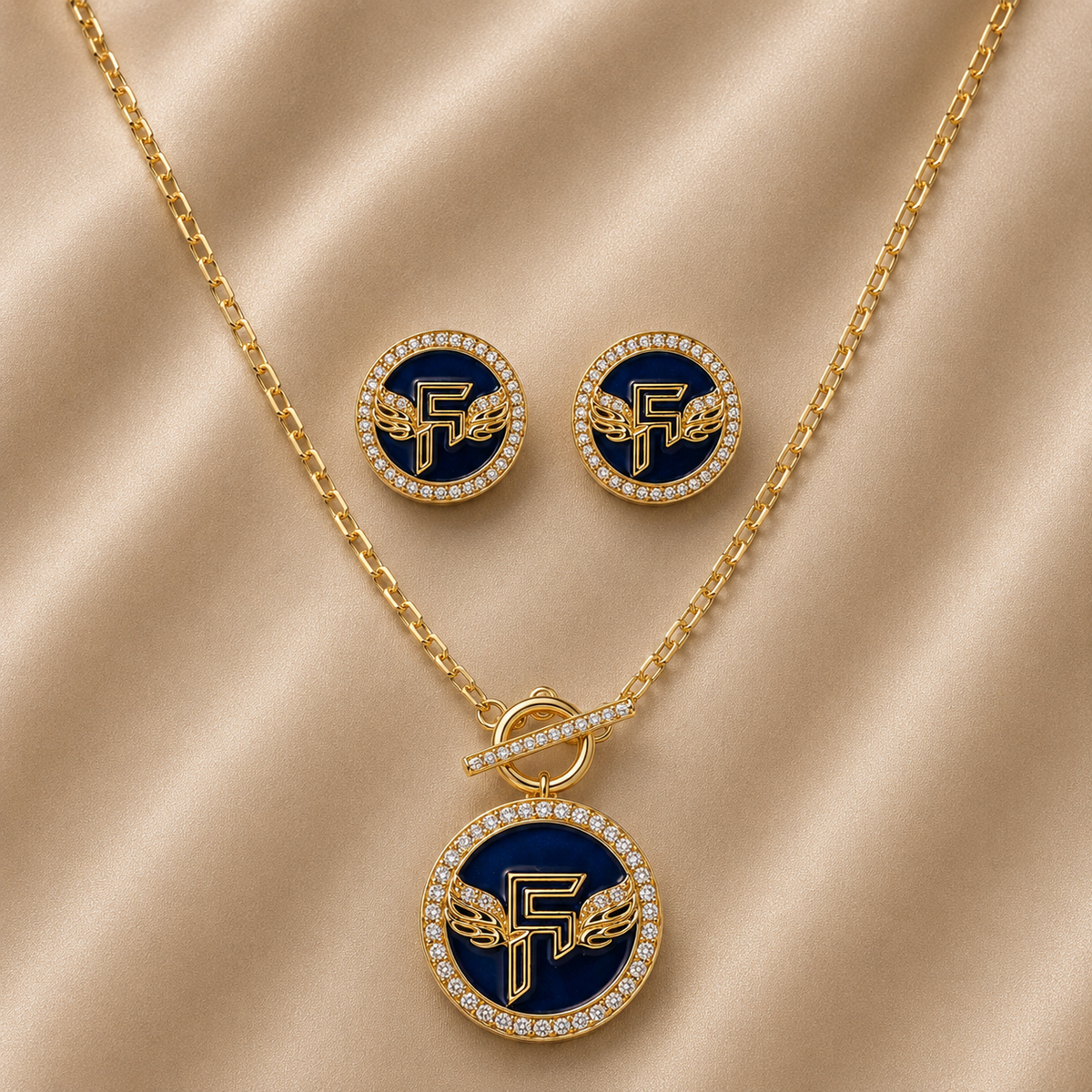 Jewelry set with necklace, earrings, and pendant on a beige fabric background