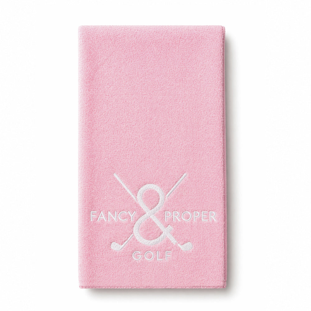 Green golf towel with 'Fancy & Proper Golf' logo on a white background